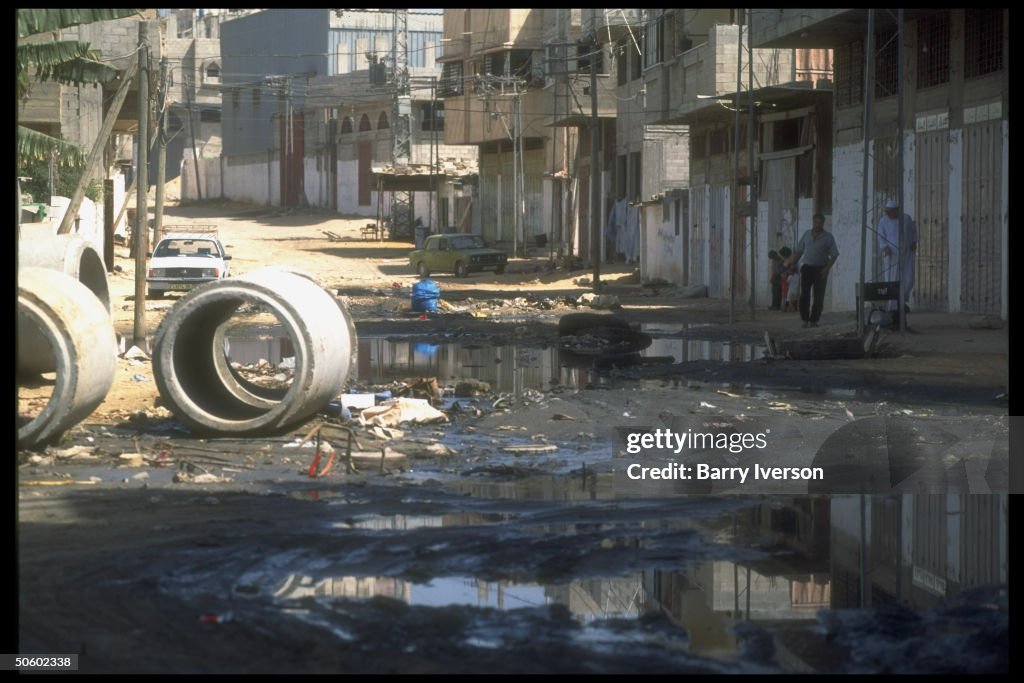 Sewage & garbage-strewn street in (World