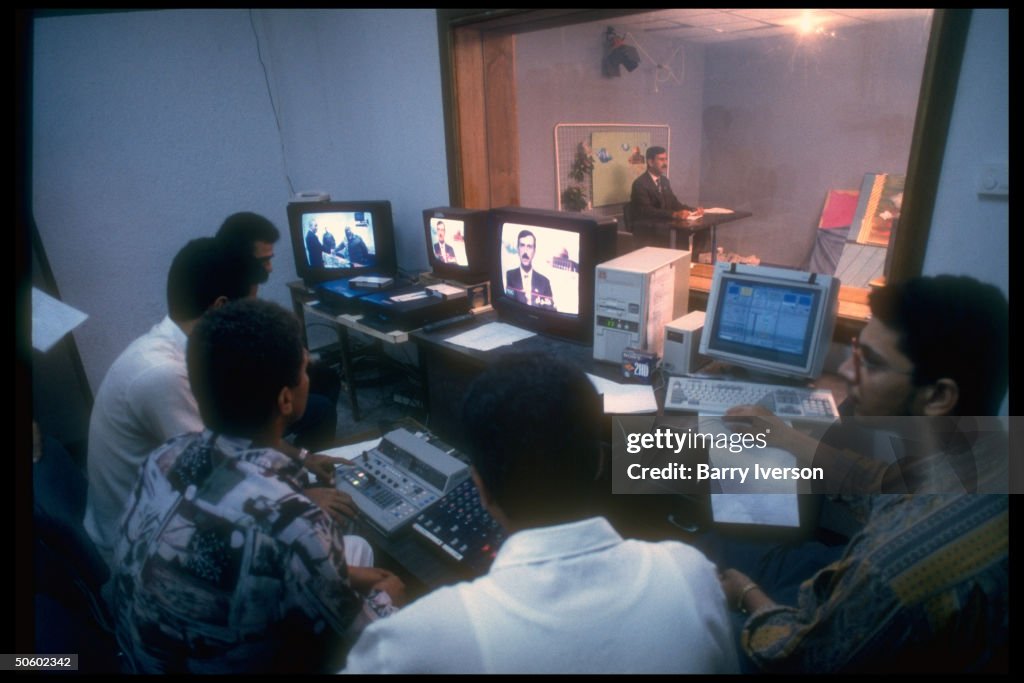 Staff screen-monitoring live studio broa
