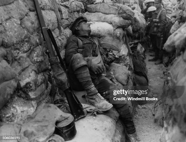 British Soldier asleep in a front line trench; Theipval. September, 1916. British Front - France '16 General Battle Somme.