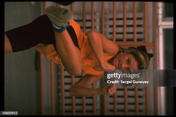 Woman practicing martial arts move, female bodyguard in training at Sports Club Legion in St. Petersburg, Russia.