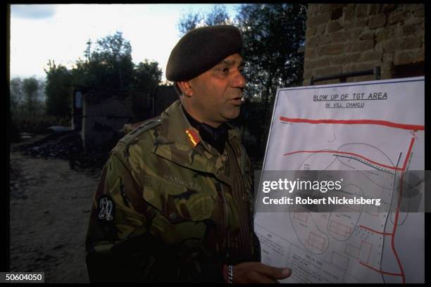Indian Army officer using chart outlining recent battles fought w. Kashmiri militants in ongoing separatist conflict, in Baramulla district of...