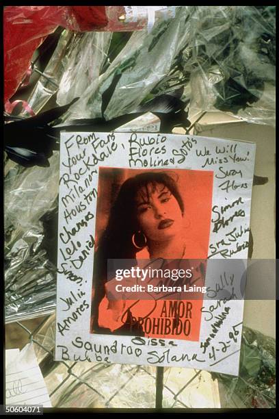 Pic of Tejano singer Selena signed by fans hanging on fence at the Quintanilla compound; Selena was shot to death by her fan club pres. Yolanda...