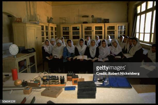 Govt. Girl's high school class in science re threat of closure by Islamic Taliban civil war faction nring city opposing education for women.