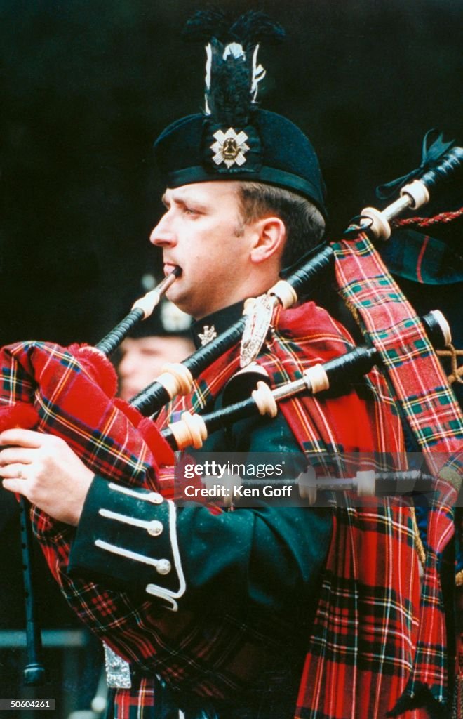 Scottish Royal Guards bagpiper in tartan