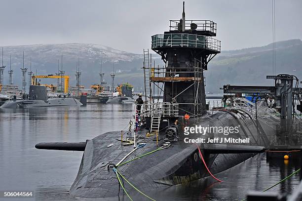 Royal Navy security personnel stand guard on HMS Vigilant at Her Majesty's Naval Base, Clyde on January 20, 2016 in Rhu, Scotland. HMS Vigilant is...