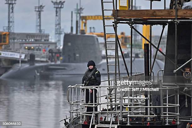 Royal Navy security personnel stand guard on HMS Vigilant at Her Majesty's Naval Base, Clyde on January 20, 2016 in Rhu, Scotland. HMS Vigilant is...