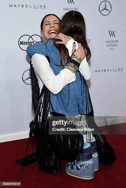 Funda Vanroy and her daughter Emilia attend the Dimitri show during the Mercedes-Benz Fashion Week Berlin Autumn/Winter 2016 at Brandenburg Gate on...