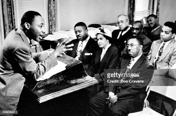 American Religious and Civil Rights leader Dr Martin Luther King Jr director of segregated bus boycott, brimming with enthusiasm as he outlines...