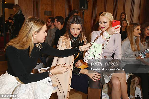 Sophie Hermann, Eva Padberg and Franziska Knuppe attend the Marina Hoermanseder show as part of Der Berliner Mode Salon during the Mercedes-Benz...