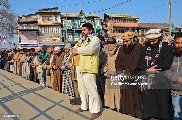 Yasin Malik Chairman of the Jammu and Kashmir Libration Front a pro Kashmir resistance party along with many of his supporters offer funeral prayers...