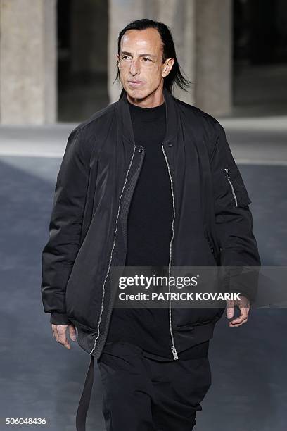 Fashion designer Rick Owens acknowledges the crowd after his fashion show during the men's Fashion Week for the 2016-2017 Fall/Winter collection in...