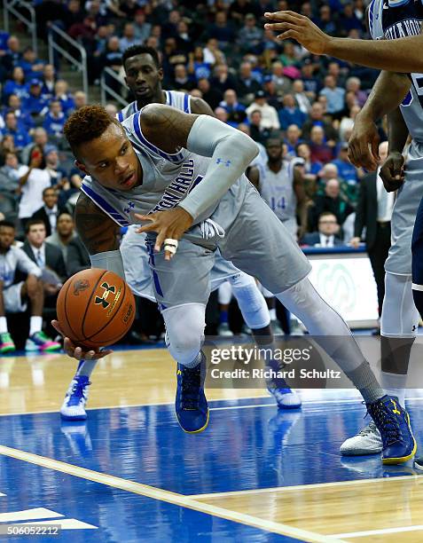 Derrick Gordon of the Seton Hall Pirates attempts to keep the ball inbounds against the Villanova Wildcats defend during the second half of an NCAA...