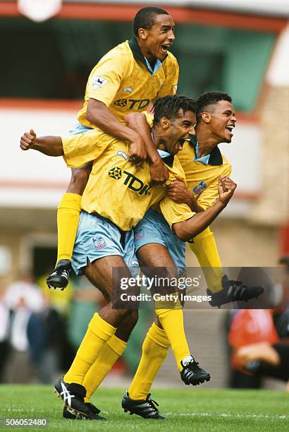 Crystal Palace forward Andy Preece celebrates with team mates Chris Armstrong and John Salako after the second goal against Arsenal at Highbury...