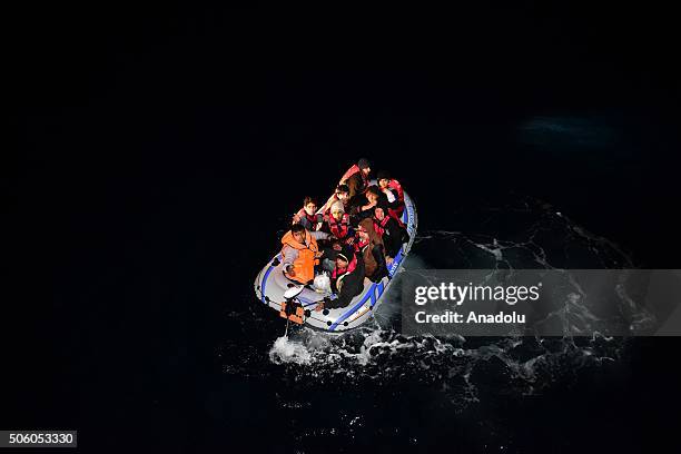 Turkish Coast Guard members intervene a boat carrying refugees, who were trying to go to Greek Islands, after being caught by the Turkish coast...