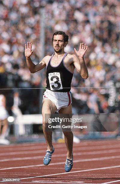 Steve Ovett from Great Britain raises his arms in celebration after crossing the finishing line to win the Men's 800 Metres event during the Great...