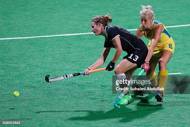 Katharina Otte of Germany shields the ball from Ashleigh Nelson of Australia during the TPG International Tri Series at Sengkang Hockey Stadium on...