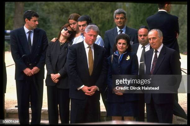Front Pres. Clinton, Leah Rabin & PM Peres w. Slain PM's children & grandchildren at his gravesite.