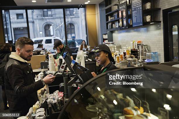 Customer orders a beverage inside a Starbucks Corp. Coffee shop in New York, U.S., on Monday, Jan. 18, 2016. Starbucks Corp. Is scheduled to release...