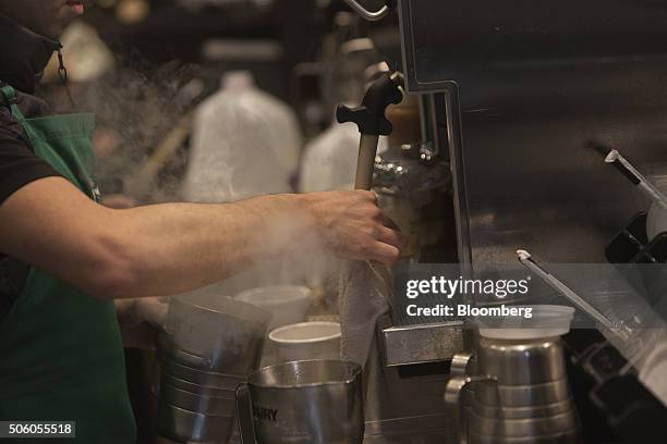 Barista cleans a milk frother inside a Starbucks Corp. Coffee shop in New York, U.S., on Monday, Jan. 18, 2016. Starbucks Corp. Is scheduled to...