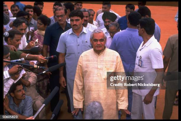 Vajpayee framed by supporters & press after submitting his resignation 13 days into post-election BJP opposition rule.