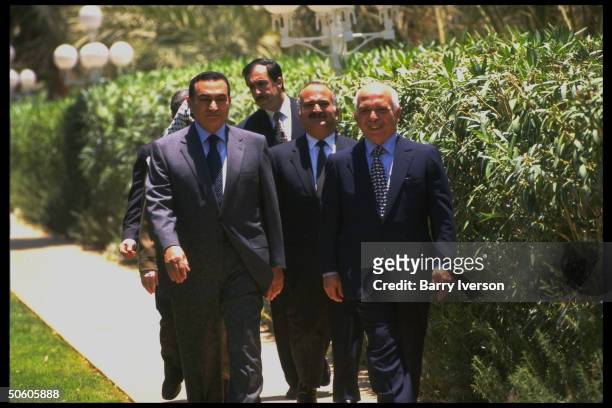 Egyptian Pres. Mubarak & King Hussein w. PLO leader Arafat & Prince Hassan in tow, strolling, discussing Israeli election of Likud PM Netanyahu.