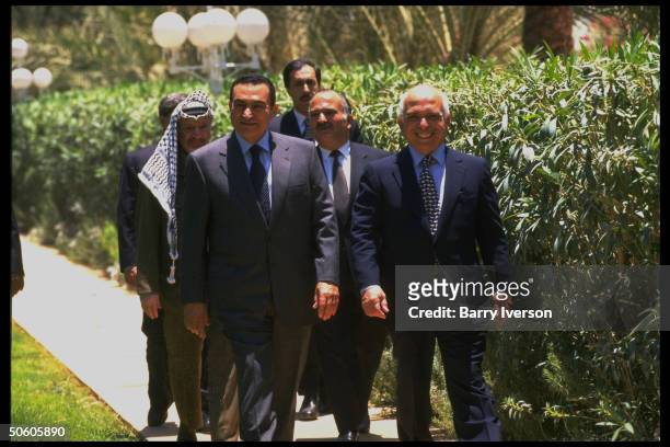 Egyptian Pres. Mubarak & King Hussein w. PLO ldr. Arafat & Prince Hassan in tow, strolling, discussing Israeli election of Likud PM Netanyahu.