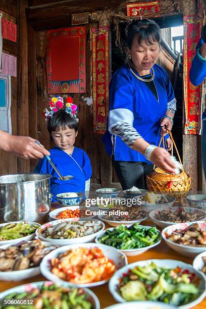 chinese dinner at home - female eating chili bildbanksfoton och bilder