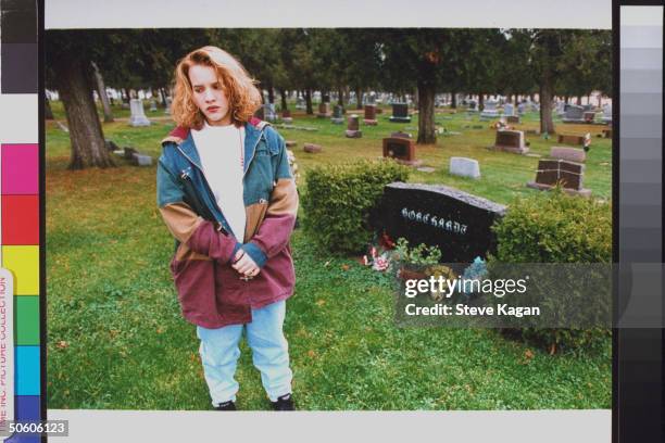 Brook Borchardt standing nr. Grave of father Ruben, who was murdered by 3 teens hired by her stepmother Diane, at cemetery.