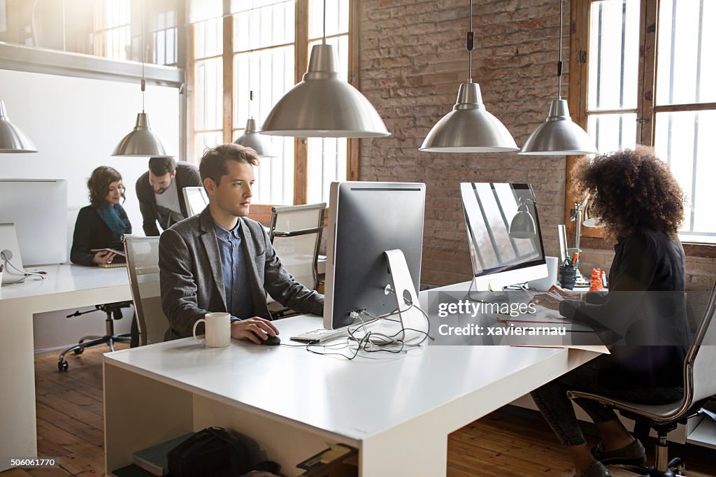 Young people working on a startup office