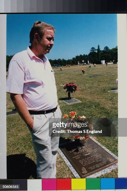 Curtis Dickson, bro. Of Dorothy Mayfield who was murdered 5 yrs. Ago by her teen daughter Gina Grant, standing nr. Sister's gravesite at Bush River...