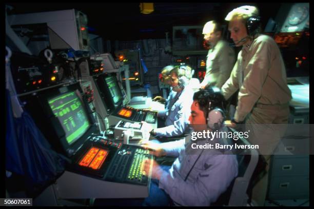 Control room aboard US Aegis class destroyer USS Russell, cruising Persian Gulf waters, enforcing no-fly zone & other restrictions against Iraq.