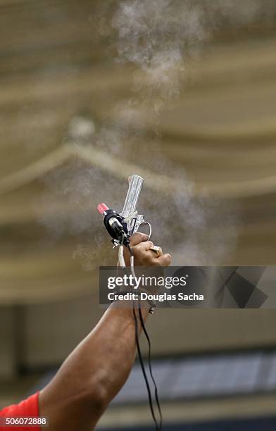 starting pistol at a race - pistola de salida fotografías e imágenes de stock