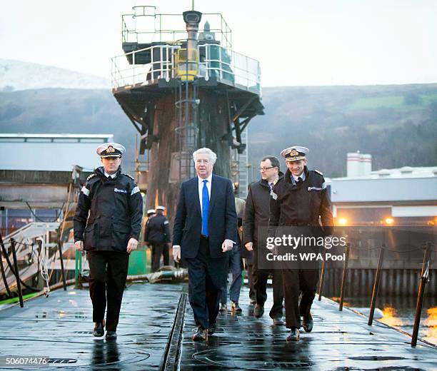 Defence Secretary Michael Fallon with Daniel Martyn Commanding Officer of HMS Vigilant and Rear Admiral of Submarines and Assistant Chief of Naval...