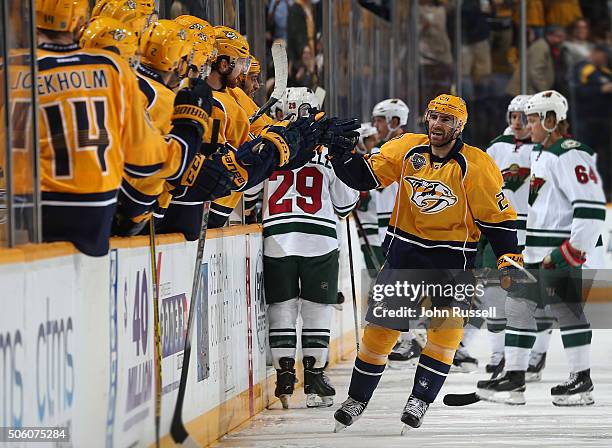 Eric Nystrom of the Nashville Predators celebrates his goal with the bench against the Minnesota Wild during an NHL game at Bridgestone Arena on...