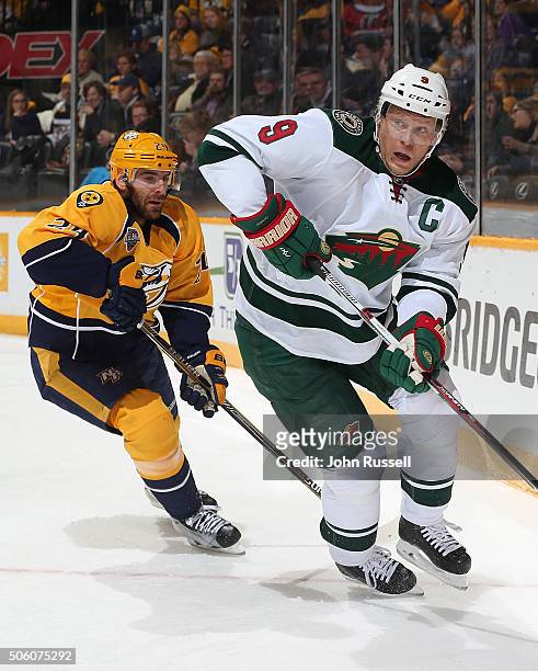 Mikko Koivu of the Minnesota Wild skates against Eric Nystrom of the Nashville Predators during an NHL game at Bridgestone Arena on January 16, 2016...