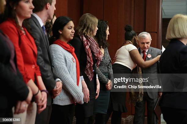 Senator Jack Reed greets college students before a news conference to unveil a legislative package to address college affordability in the U.S....