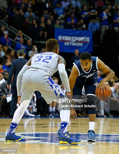 Phil Booth of the Villanova Wildcats looks to get by Derrick Gordon of the Seton Hall Pirates during the first half of an NCAA college basketball...