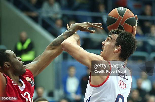 Henry Walker, #12of Cedevita Zagreb competes with Dario Saric, #9 of Anadolu Efes Istanbul during the Turkish Airlines Euroleague Basketball Top 16...