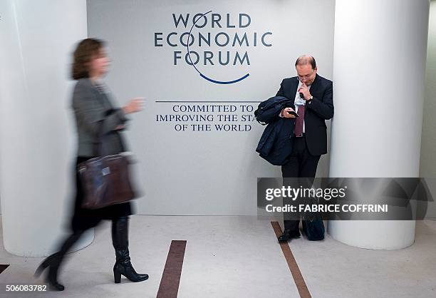 Guests stand at the Congress Centre during the World Economic Forum annual meeting in Davos on January 21, 2016. Rising risks to the global economy...