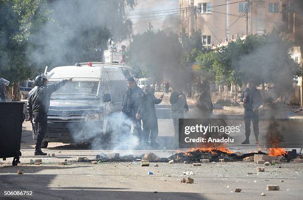 Riot police intervene to the protesters during a protest, staged by unemployed young citizens against unemployment and poverty in Tataouine, Tunisia...