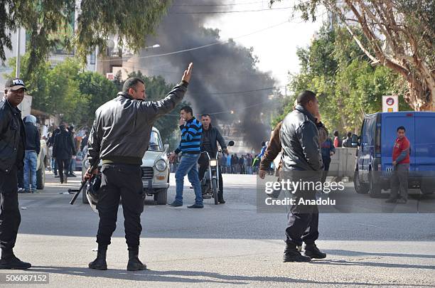 Riot police intervene to the protesters during a protest, staged by unemployed young citizens against unemployment and poverty in Tataouine, Tunisia...