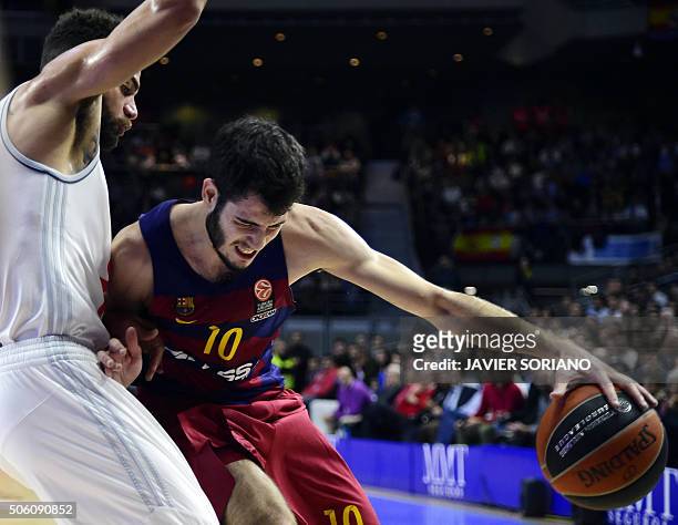 Barcelona's forward Alex Abrines vies with Real Madrid's Swedish forward Jeffery Taylor during the Euroleague group F Top 16 round 4 basketball match...