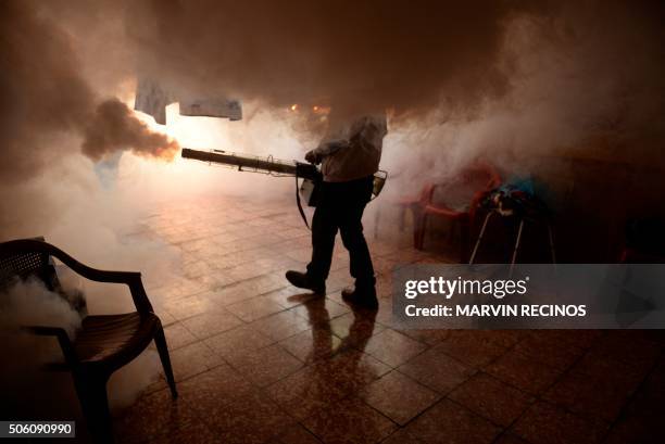 Health Ministry employee fumigates a home against the Aedes aegypti mosquito to prevent the spread of the Zika virus in Soyapango, six km east of San...