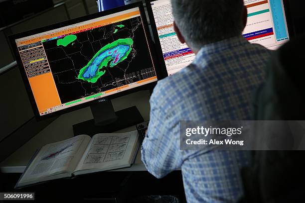 Forecaster analyses data of an incoming winter storm January 21, 2016 at the NOAA Center for Weather and Climate Prediction in College Park,...