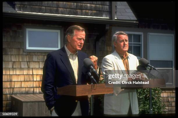 Pres. Bush & Canadian PM Brian Mulroney at twin podiums, outside Bush home, holding news conf. After gulf crisis mtg.