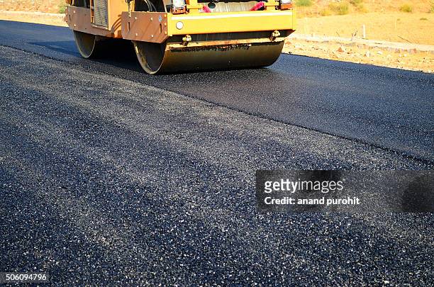 roller paving new asphalt road, rajasthan, india - asphalt roller stock pictures, royalty-free photos & images