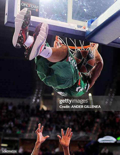 Laboral Kutxa's Hungarian forward Adam Hanga slum-dunks the ball during the Euroleague group F Top 16 round 4 basketball match Laboral Kutxa Vitoria...