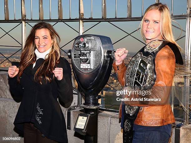 Challenger Miesha Tate and UFC Women's Bantamweight champion Holly Holm visit The Empire State Building at The Empire State Building on January 21,...