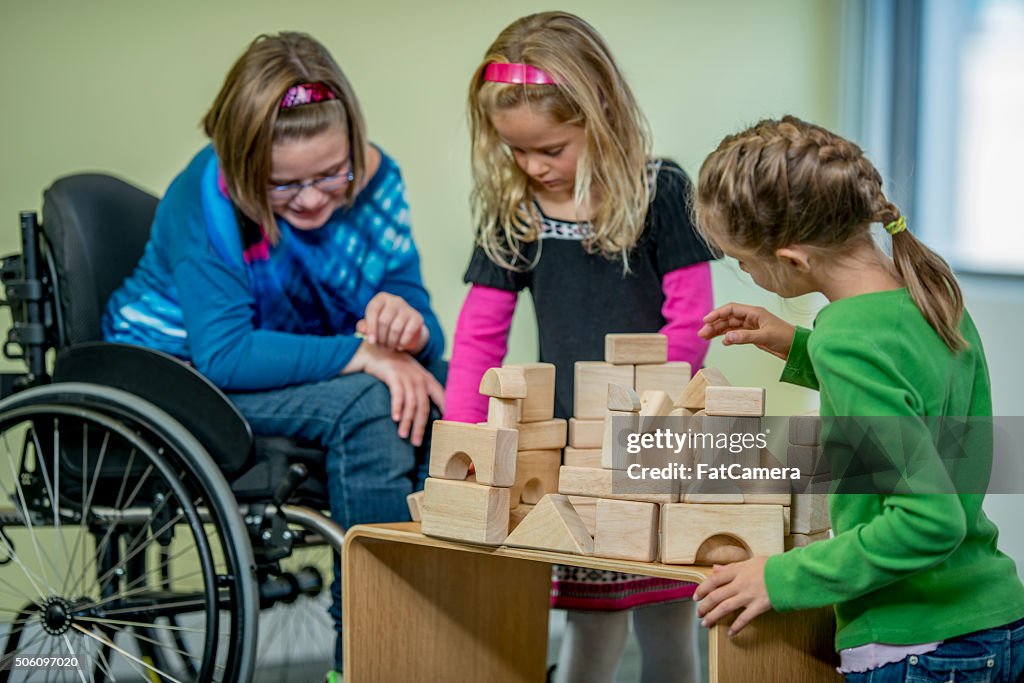 Girls Playing with Wooden Blocks