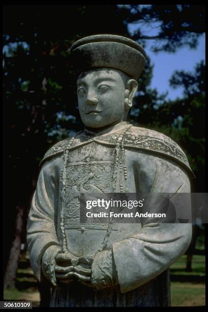 Stone scholar statue on Spirit Way, sacred path to Western Qing Tombs, site of new luxury Hualong Cemetery for rich, overseas Chinese to buy imperial...